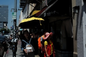 Lady with a yellow umbrella in Little Tokyo